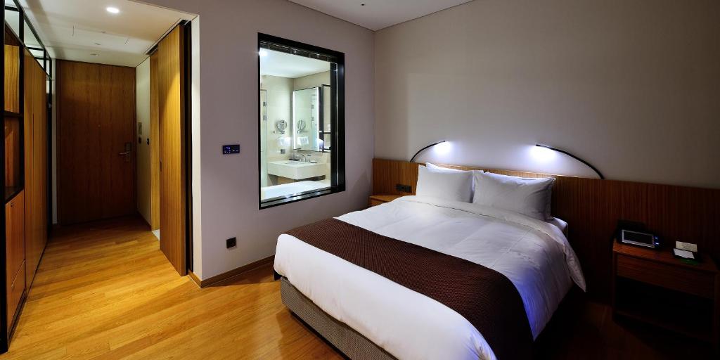 Postel nebo postele na pokoji v ubytování Midas Hotel & Resort