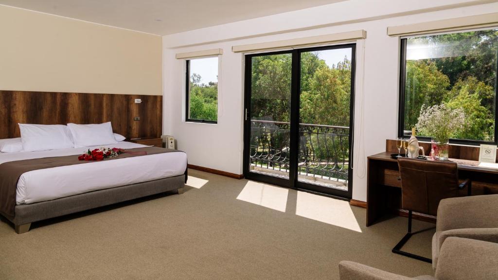Кровать или кровати в номере Hotel Villa del Carmen