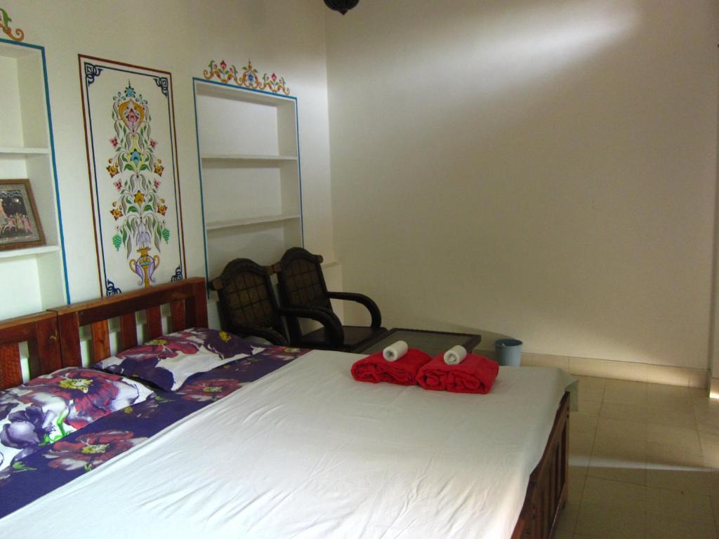 Postel nebo postele na pokoji v ubytování Atithi Guest House Pushkar