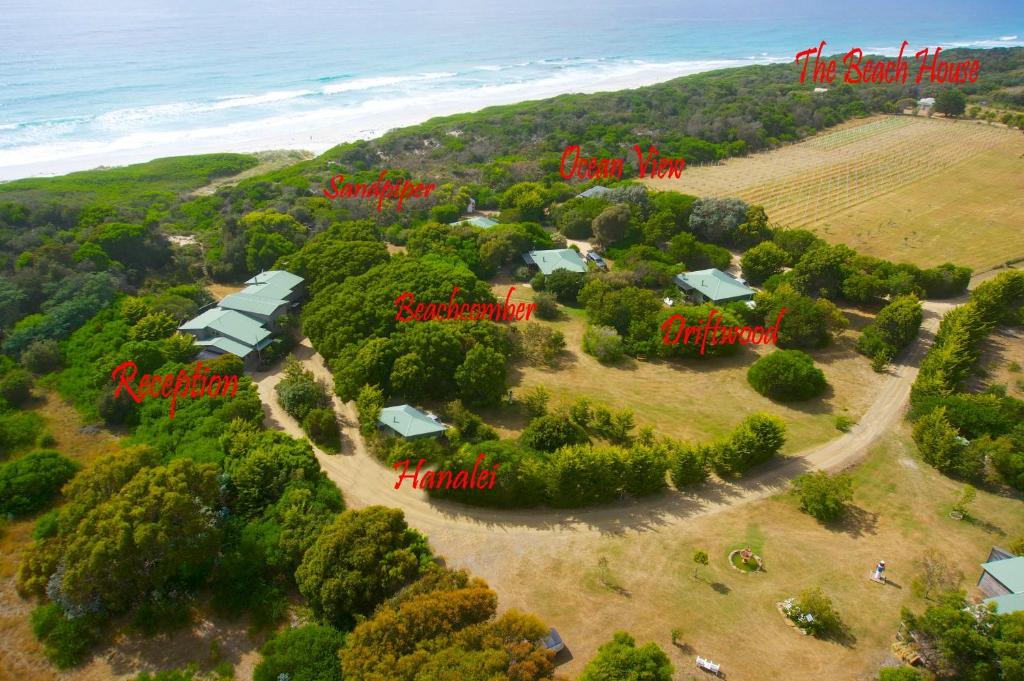 an aerial view of a farm with houses and trees at Sandpiper Ocean Cottages in Bicheno