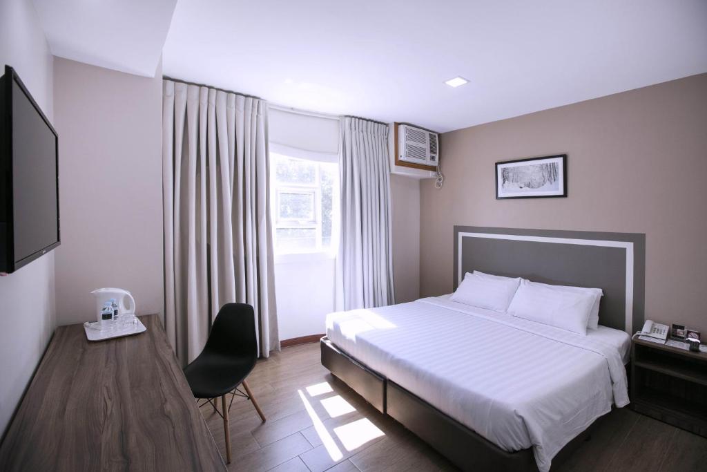 TV a/nebo společenská místnost v ubytování S Hotel & Residences