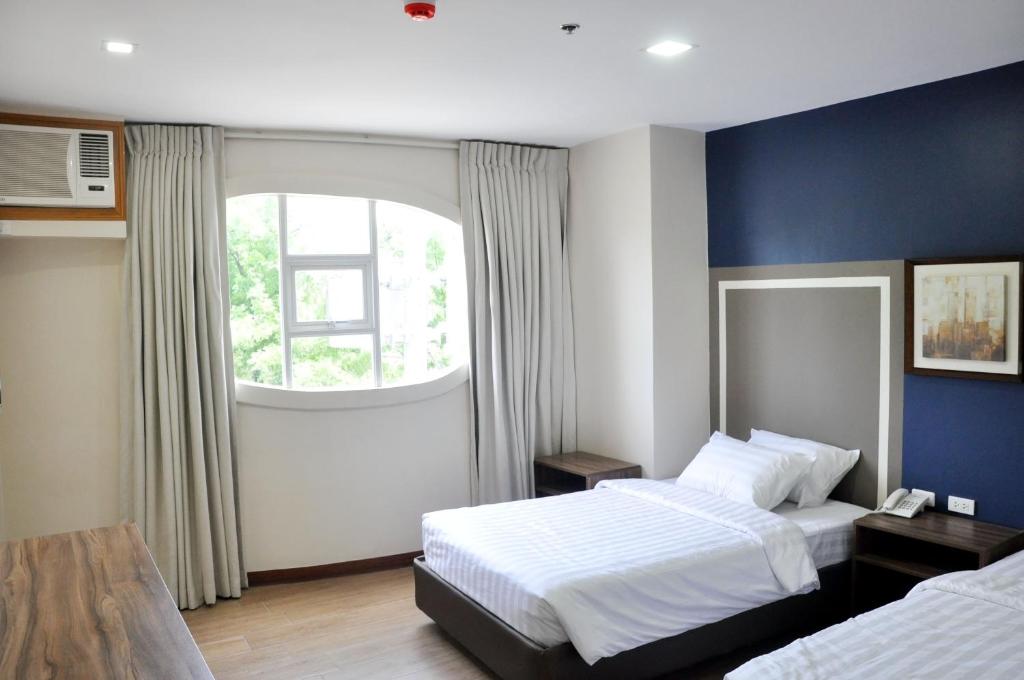 Postel nebo postele na pokoji v ubytování S Hotel & Residences