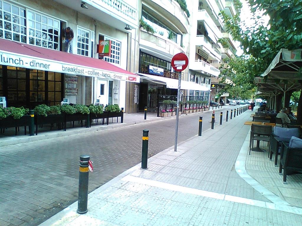 a city street with a do not enter sign at Tranquil Central Apt, behind Athens Caravel Area in Athens