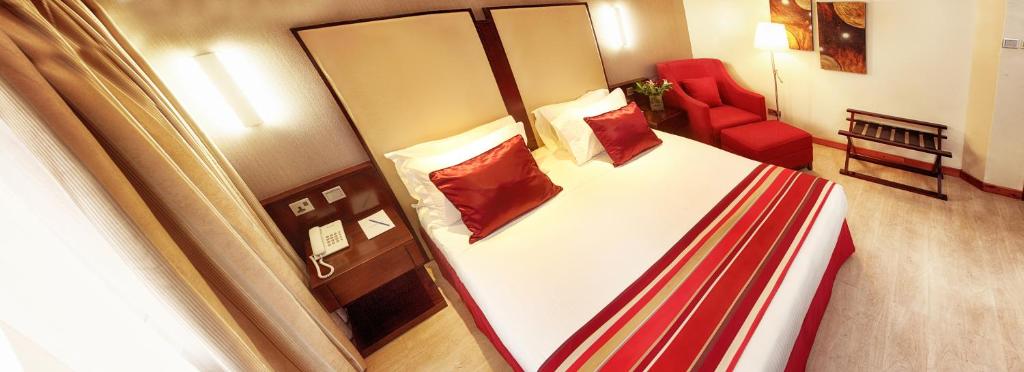 Cama o camas de una habitación en The Zehneria Hotel