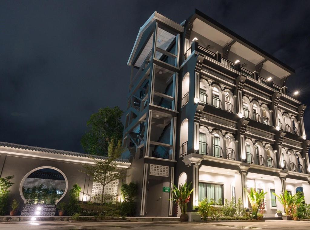 an image of a building at night at The Besavana Phuket - SHA Extra Plus in Phuket Town