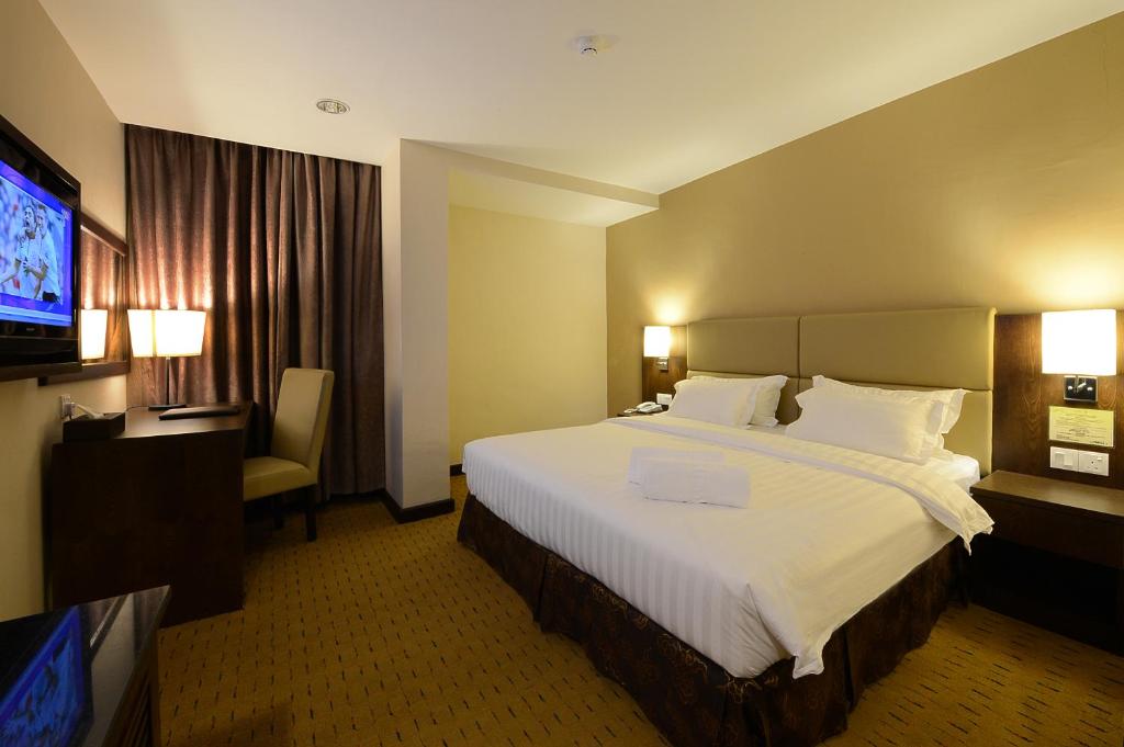 Postel nebo postele na pokoji v ubytování Lintas View Hotel