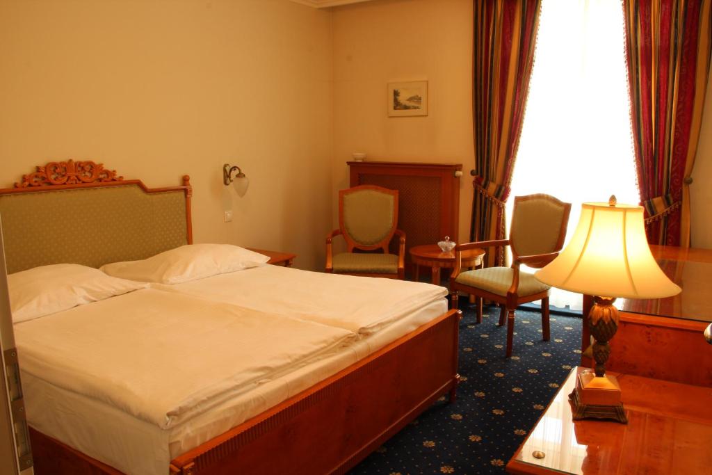Postel nebo postele na pokoji v ubytování Luxury Garni Hotel Brix