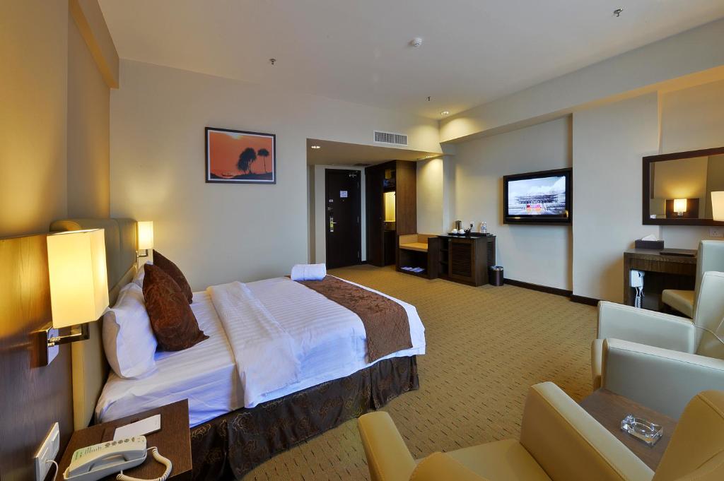 Postel nebo postele na pokoji v ubytování Lintas View Hotel