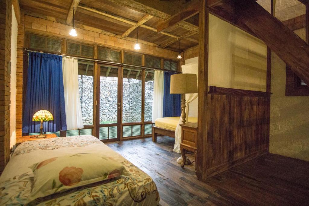 Postel nebo postele na pokoji v ubytování Harum Manis Villa