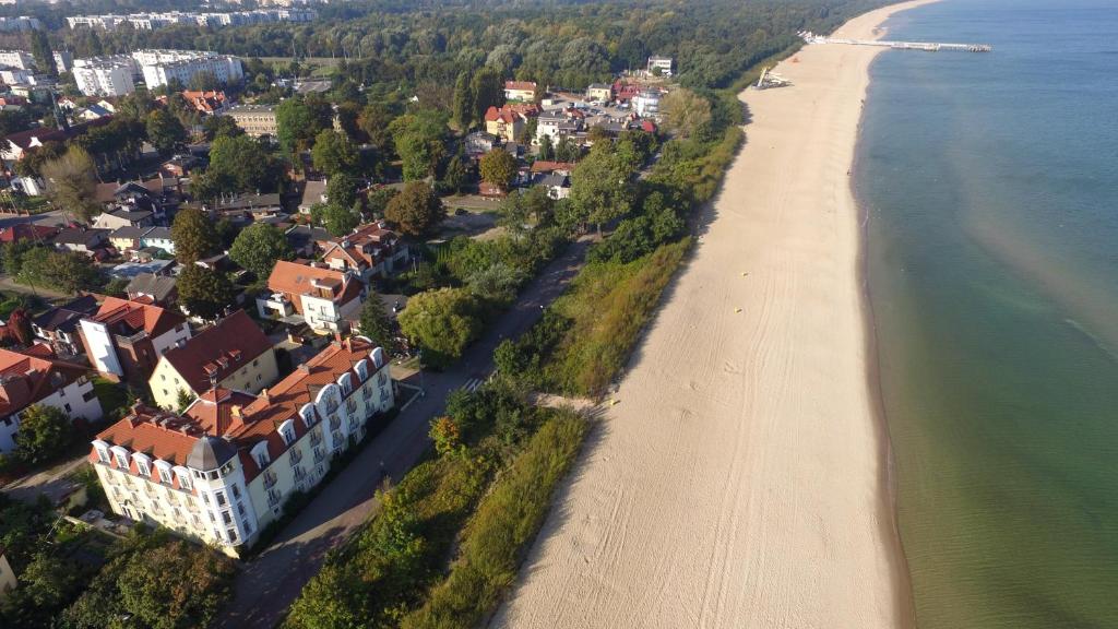 an aerial view of a beach and a resort at Hotel Lival in Gdańsk