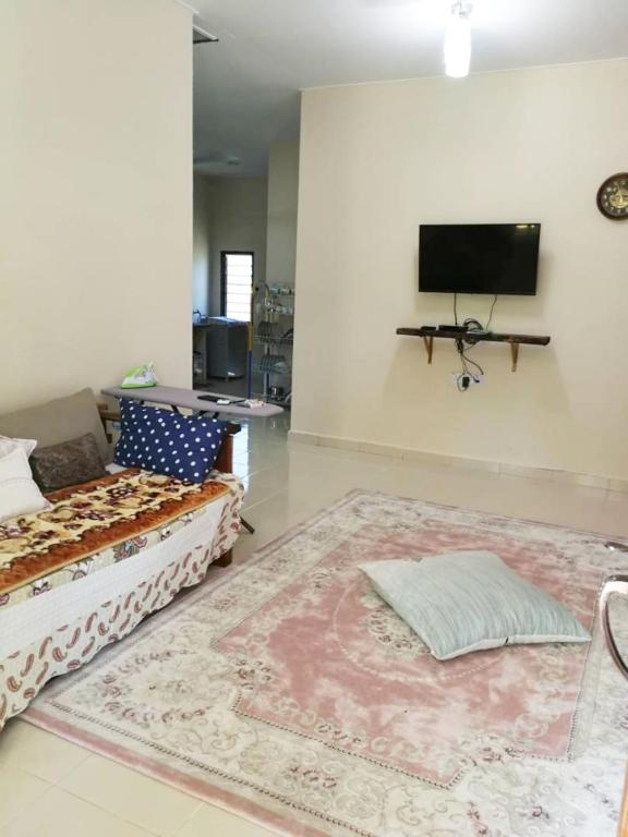 Postel nebo postele na pokoji v ubytování Homestay Pulau Langkawi