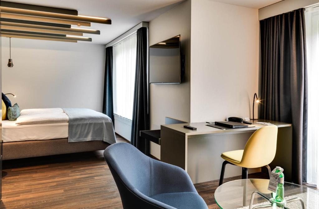 Postel nebo postele na pokoji v ubytování Park Hotel Zug