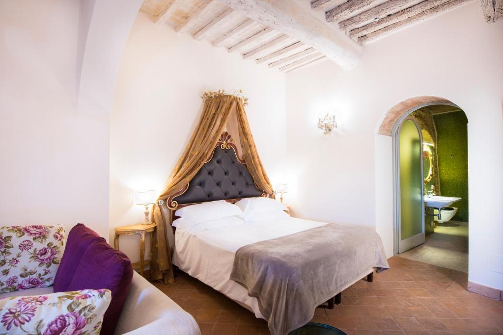 Postel nebo postele na pokoji v ubytování Palazzo Pacini