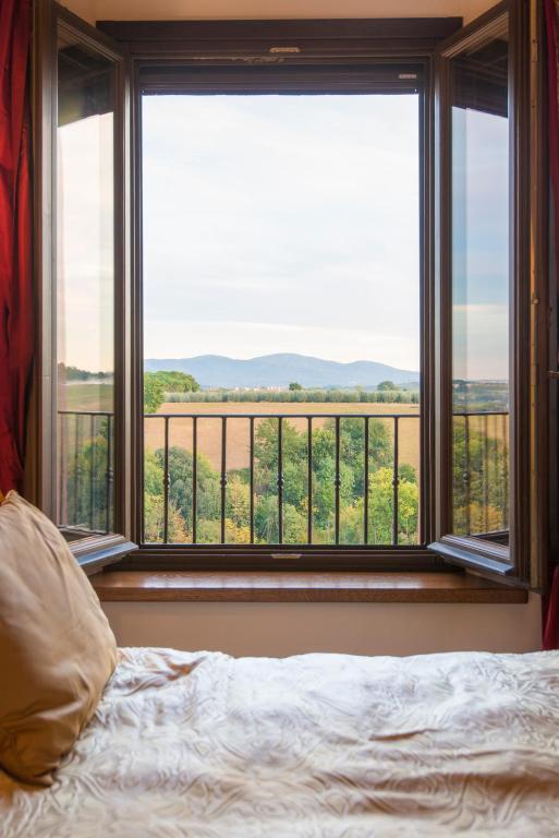 Postel nebo postele na pokoji v ubytování Palazzo Pacini