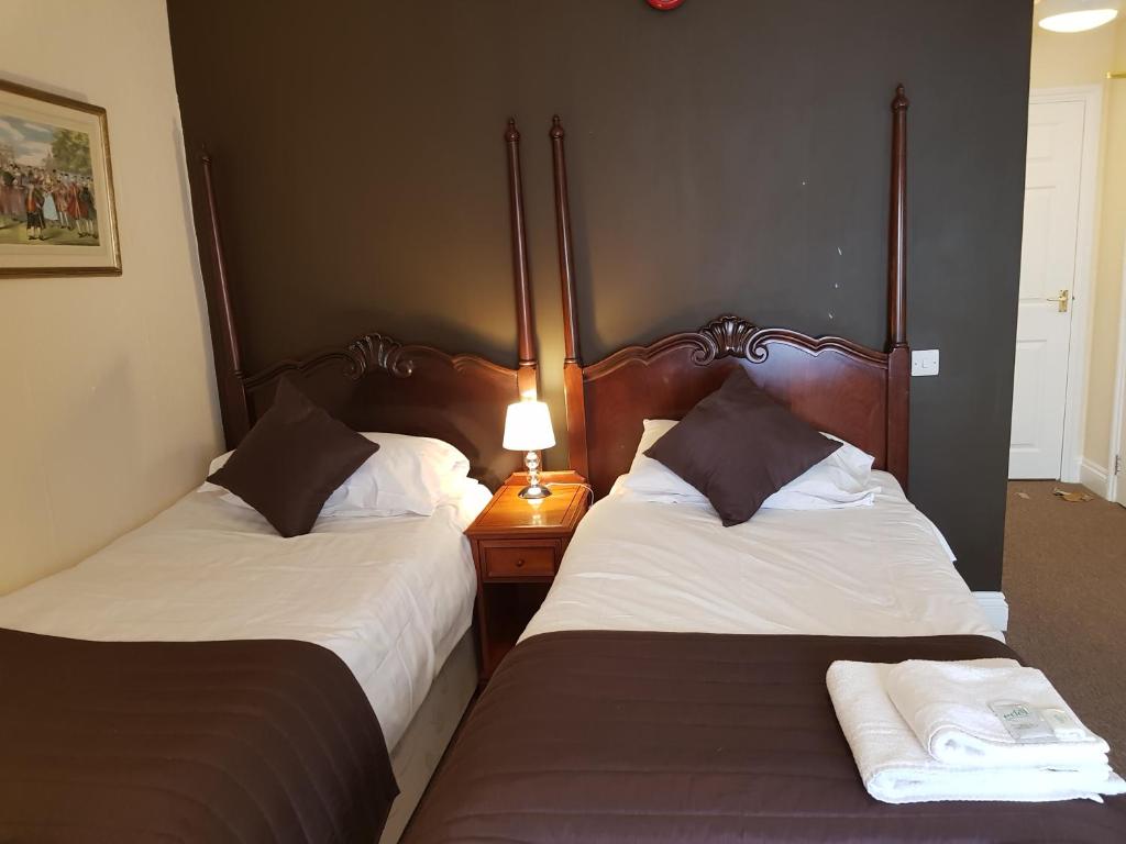 Postel nebo postele na pokoji v ubytování Old George Hotel