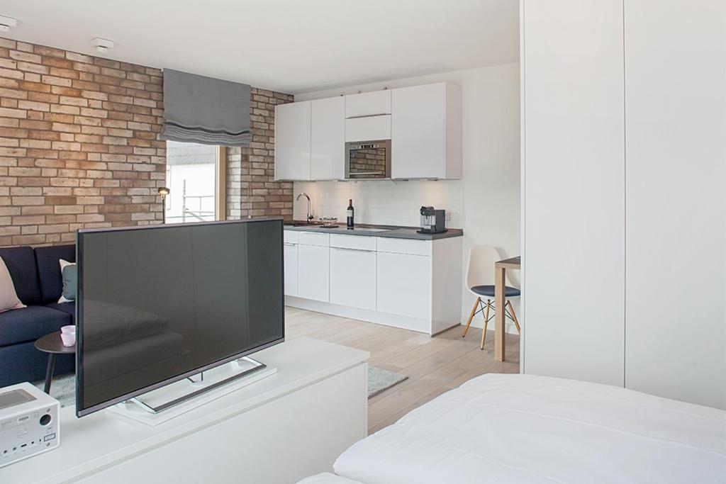 Kuchyň nebo kuchyňský kout v ubytování 2,5 Zi Design Loft Wohnung mit Gartensitzplatz