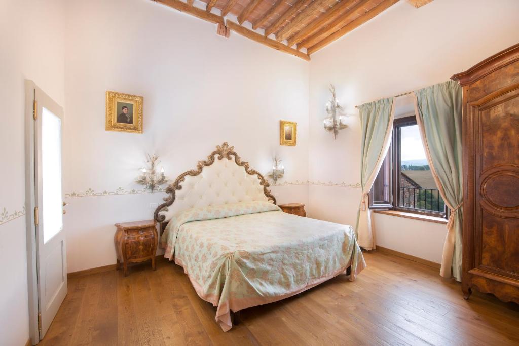Postel nebo postele na pokoji v ubytování Palazzo Pacini
