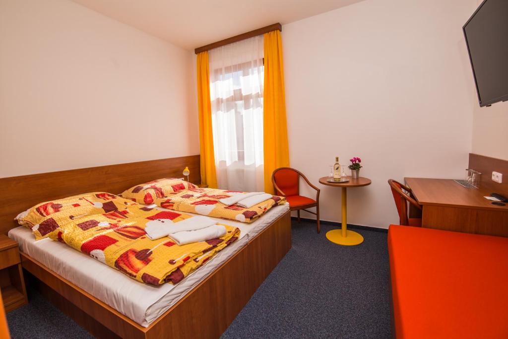 Voodi või voodid majutusasutuse Hotel Morava toas