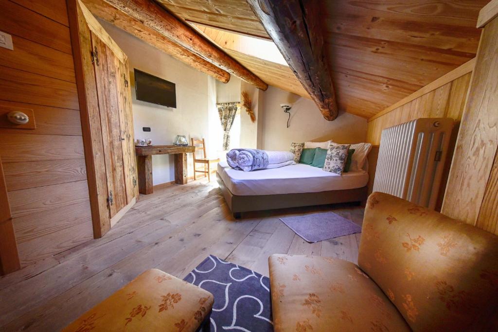 Postel nebo postele na pokoji v ubytování Agriturismo Baita De L'ALL