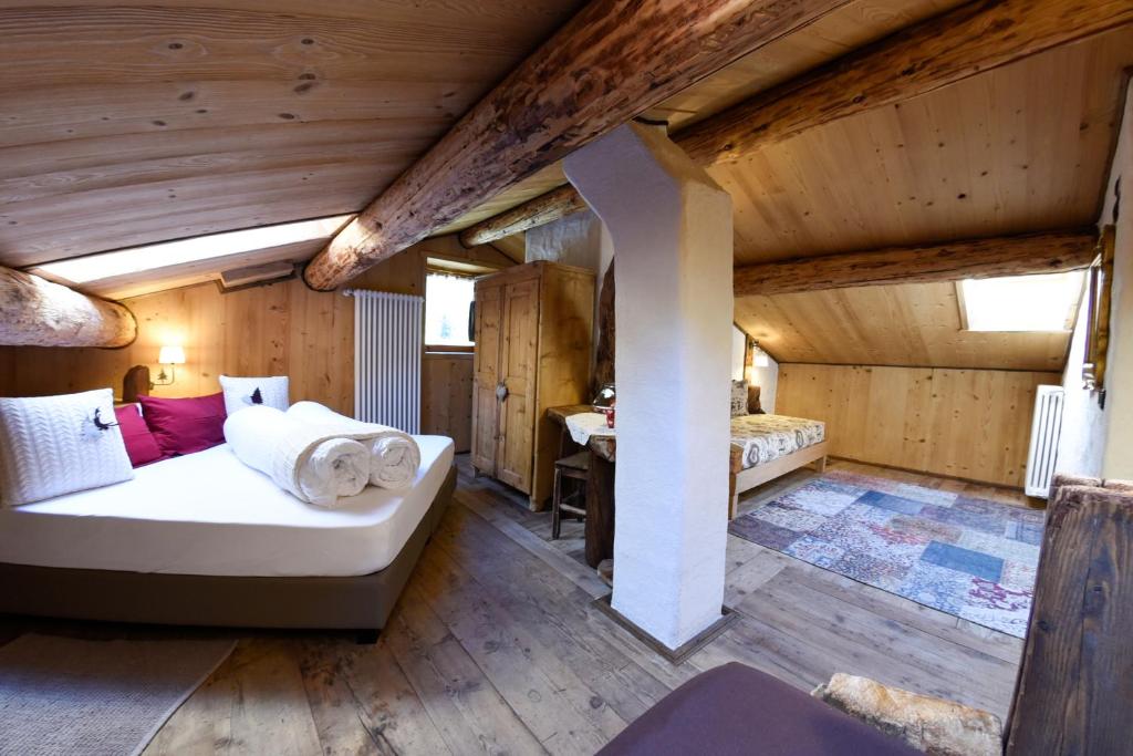 Postel nebo postele na pokoji v ubytování Agriturismo Baita De L'ALL