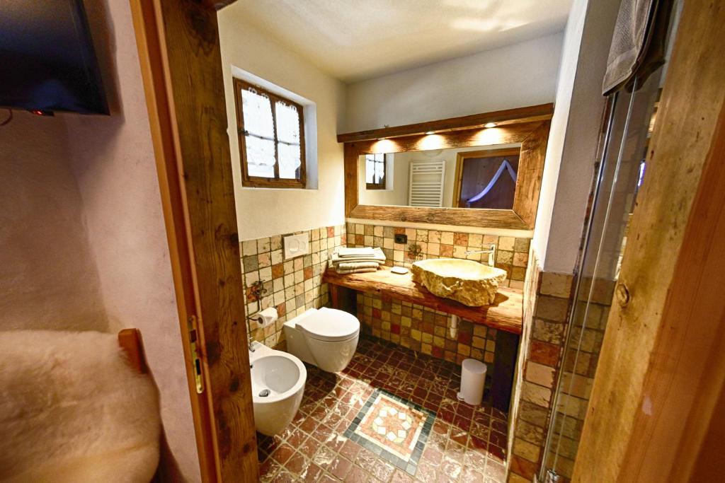 Koupelna v ubytování Agriturismo Baita De L'ALL