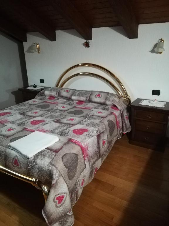 Łóżko lub łóżka w pokoju w obiekcie Casa D'antan Gressan