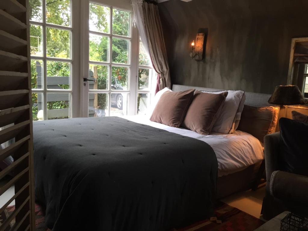 Katil atau katil-katil dalam bilik di De Schuilhoek Private Guesthouse