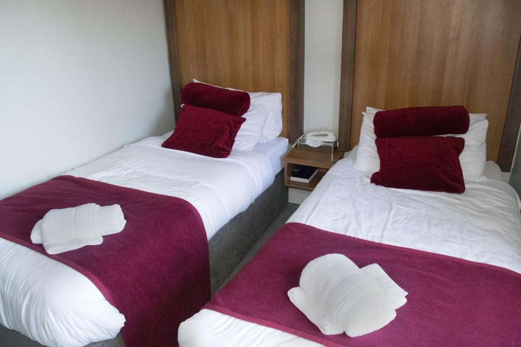 Giường trong phòng chung tại Ravine Hotel
