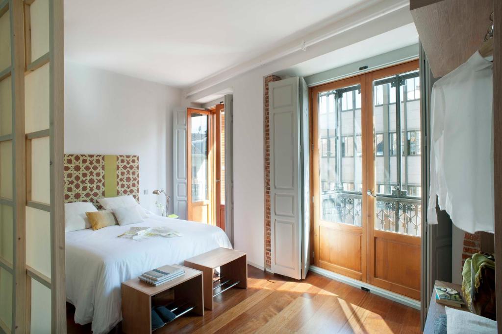 Cama o camas de una habitación en Eric Vökel Boutique Apartments - Madrid Suites
