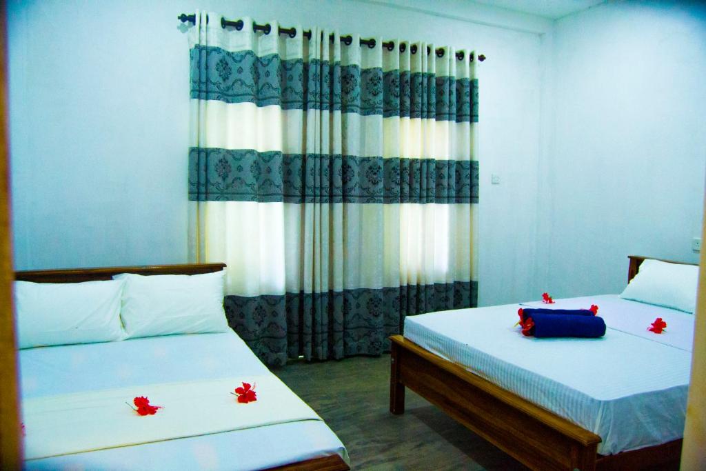 Postel nebo postele na pokoji v ubytování Amba Sewana Homestay