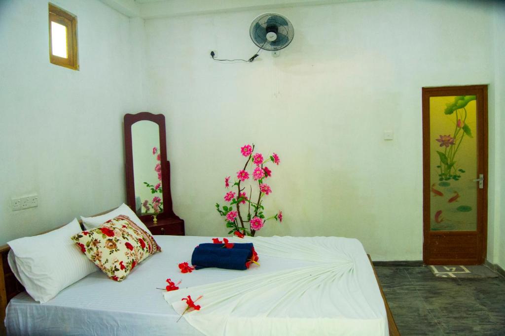 Postel nebo postele na pokoji v ubytování Amba Sewana Homestay