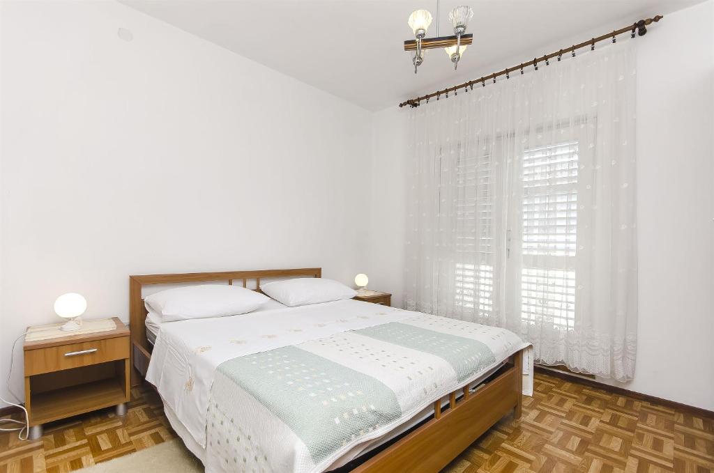 Postel nebo postele na pokoji v ubytování Apartment Niko