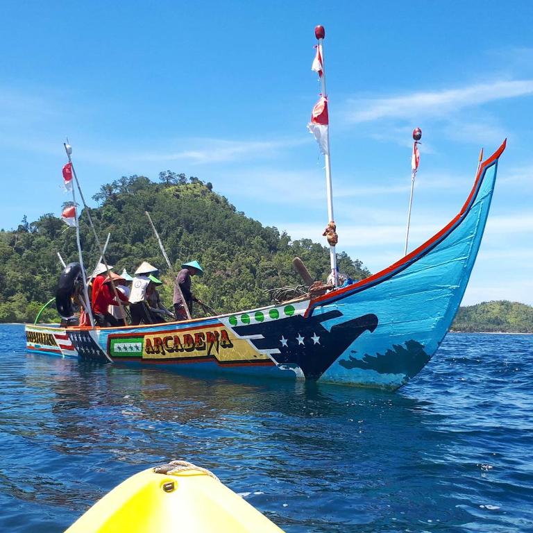 a group of people on a boat in the water at Sumatra Ecolodge in Sungaipisang