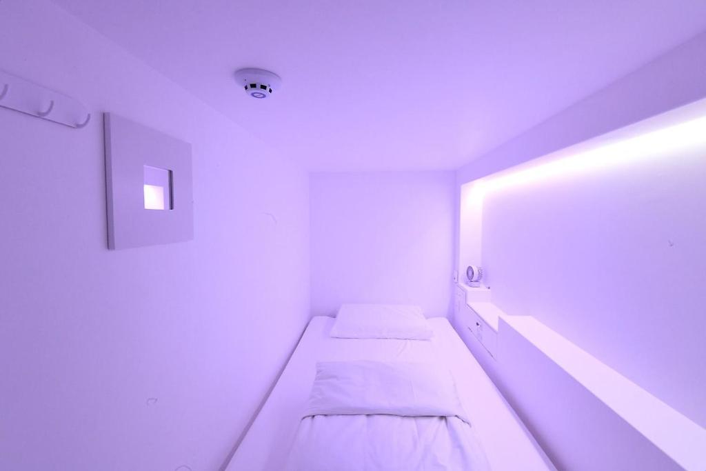 Postel nebo postele na pokoji v ubytování Gwanganli Hotel 1