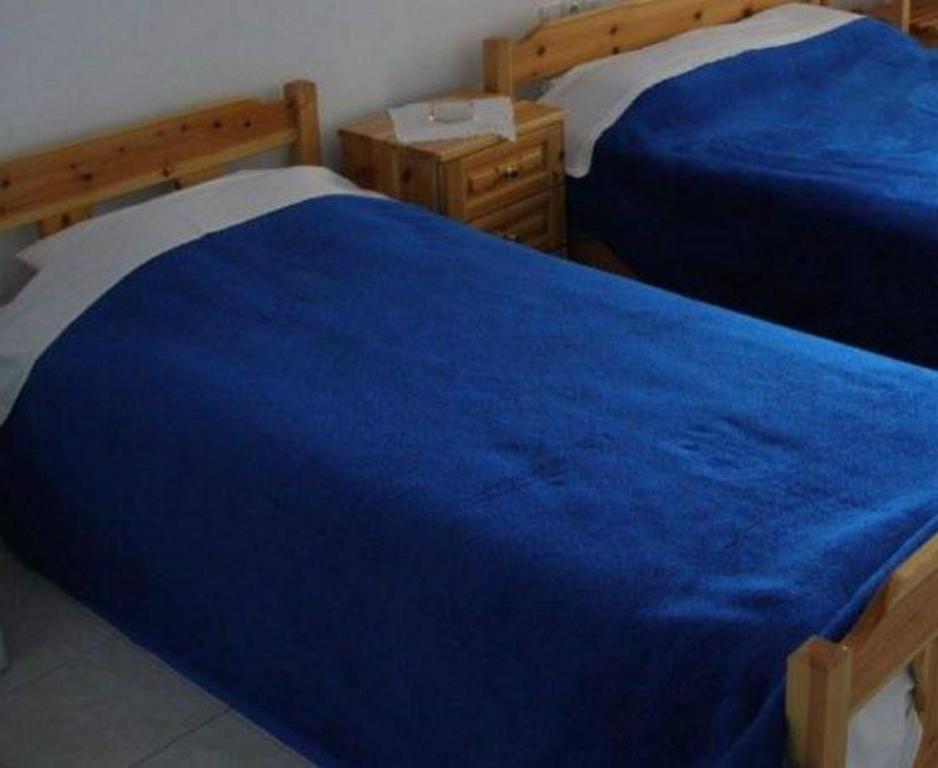 Postel nebo postele na pokoji v ubytování Hotel Alexandros