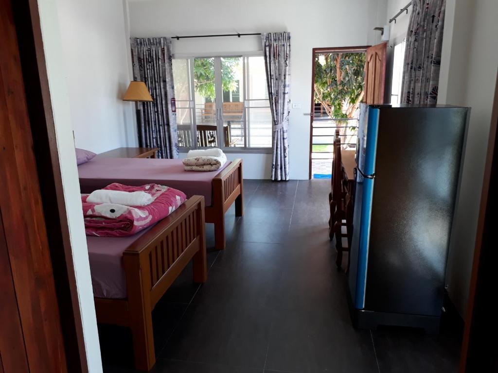 Postel nebo postele na pokoji v ubytování Green Mango Resort