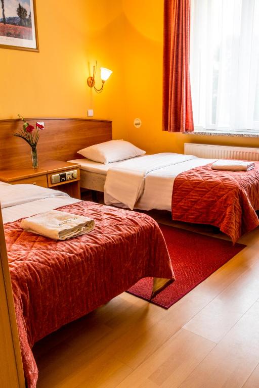 Posteľ alebo postele v izbe v ubytovaní Delta In