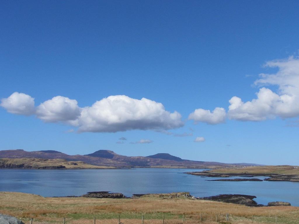 a view of a lake with mountains in the background at Ornum Self Catering Cottage in Eabost