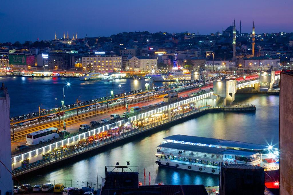 a view of a river with a city at night at Hotel Momento Golden Horn in Istanbul