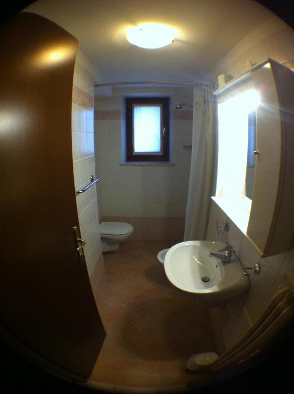 Koupelna v ubytování Hotel Scandola