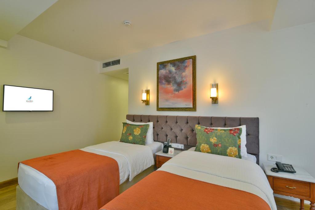 a hotel room with two beds at Istanbul Life Hotel in Istanbul