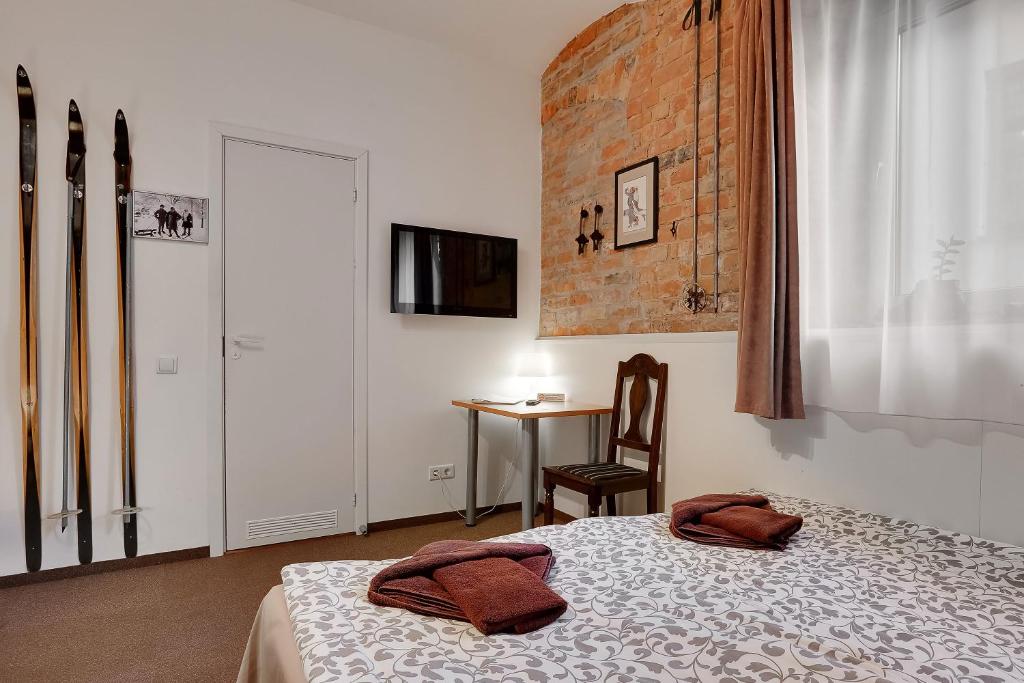 Postel nebo postele na pokoji v ubytování Janne Hotel