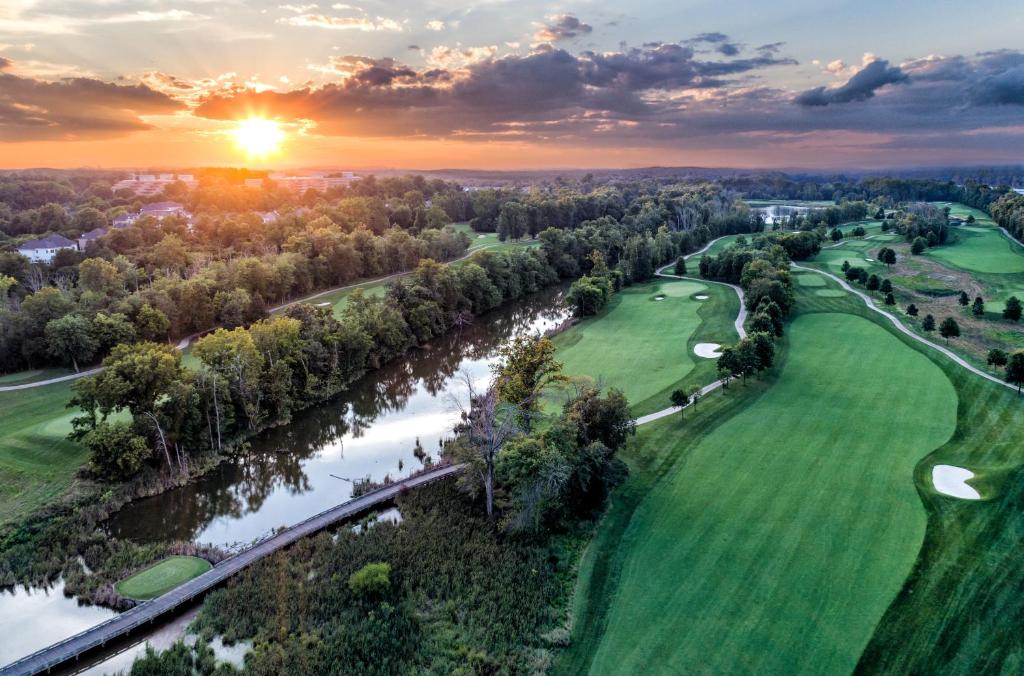an aerial view of the golf course at sunset at Lansdowne Resort and Spa in Leesburg