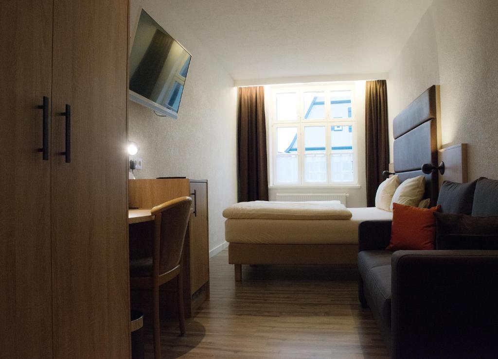 Postel nebo postele na pokoji v ubytování Hotel PIAZZA