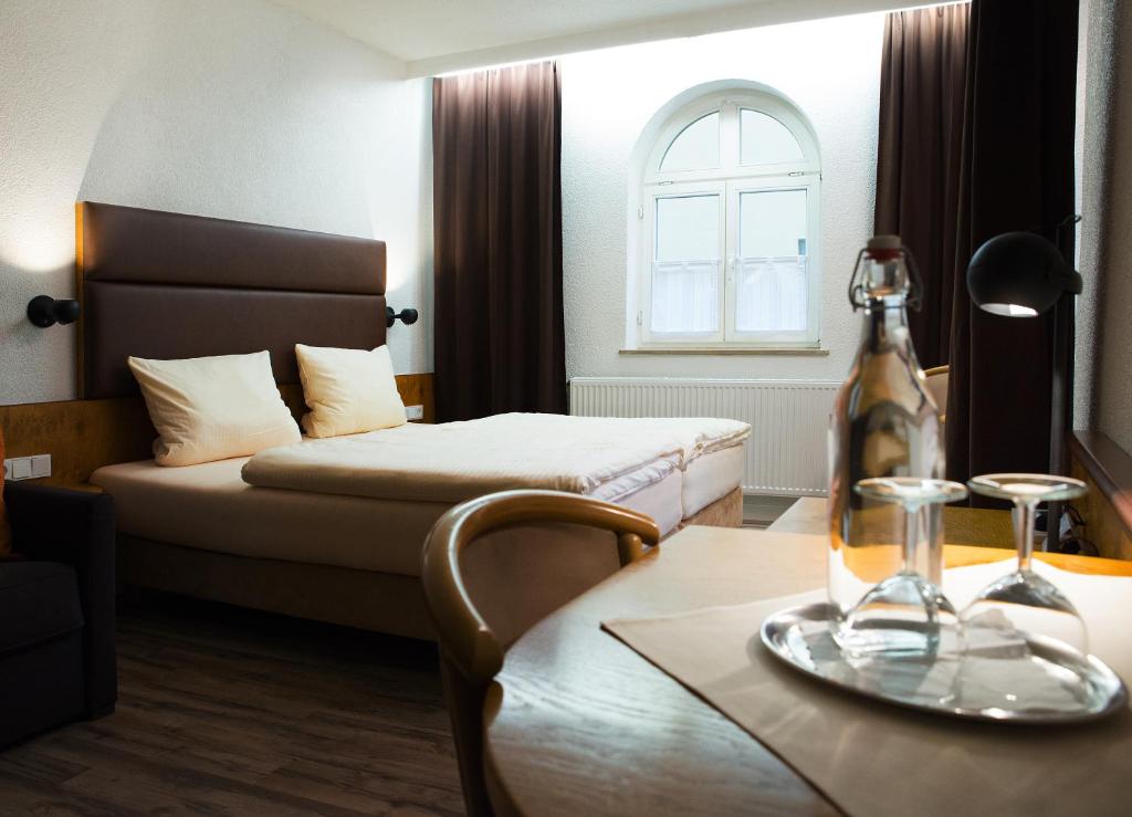מיטה או מיטות בחדר ב-Hotel PIAZZA