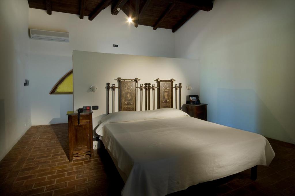 Postel nebo postele na pokoji v ubytování Foro Appio Mansio Hotel