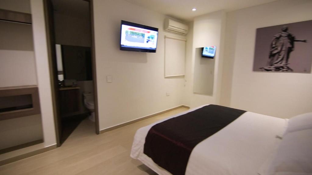 Cama o camas de una habitación en BGA Hotel