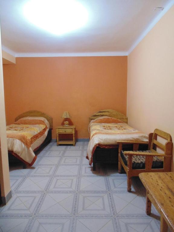 Hostal Coronel Pedro Arraya客房内的一张或多张床位