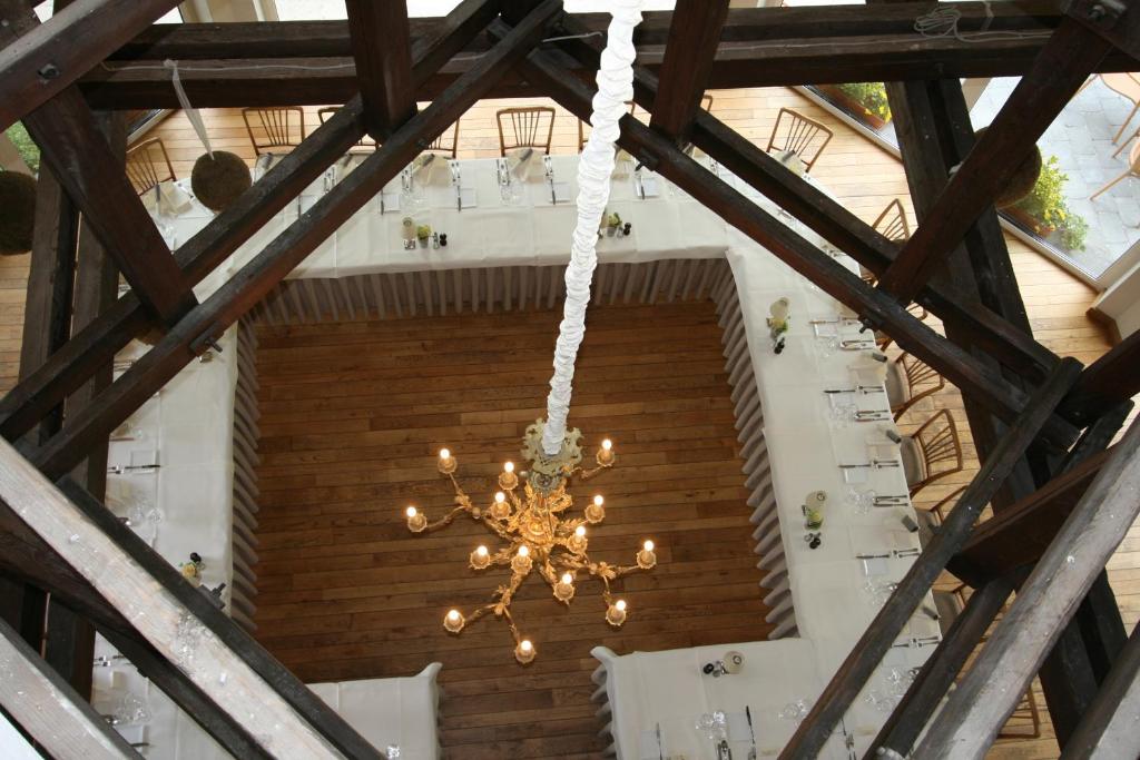 a chandelier hanging from the ceiling of a building at Cocoon Hotel Belair in Bourscheid