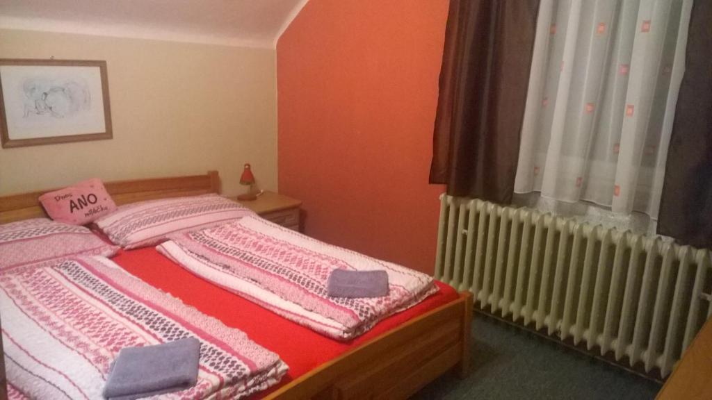 Postel nebo postele na pokoji v ubytování Penzion Lipůvka